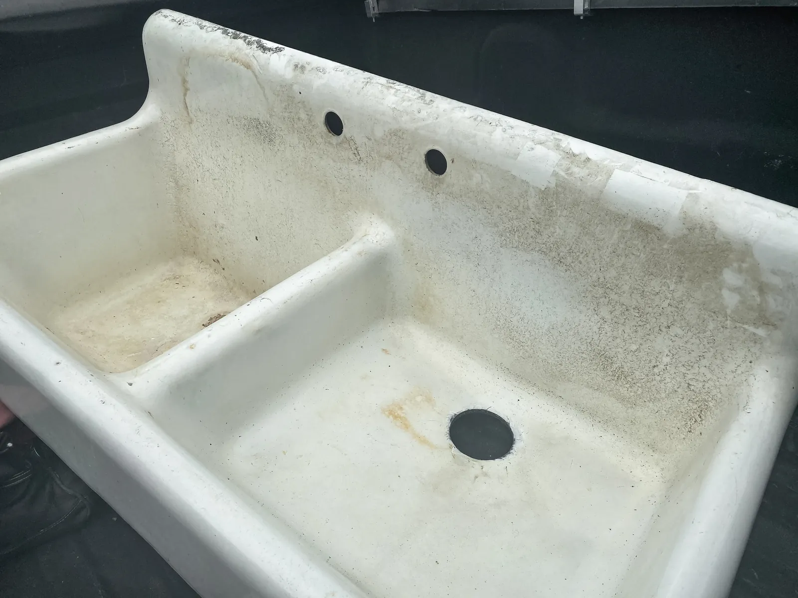 Cast iron farmhouse sink before refinishing