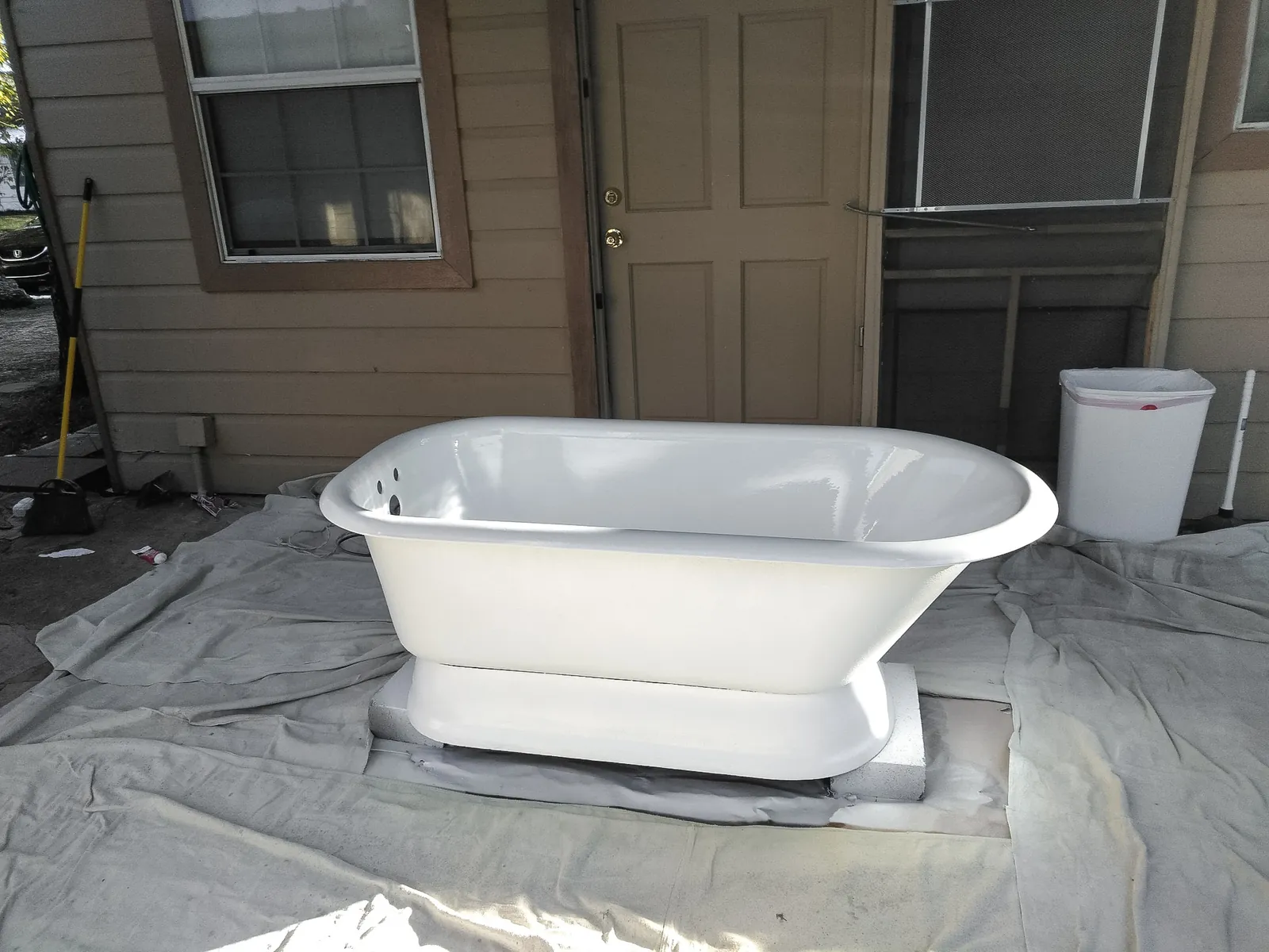 Cast iron pedestal tub after refinishing in white