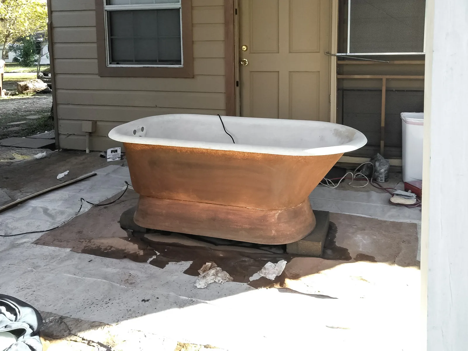 Cast iron pedestal tub before refinishing