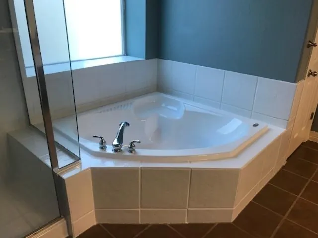 Same corner tub with the jets removed and refinished as a soaker