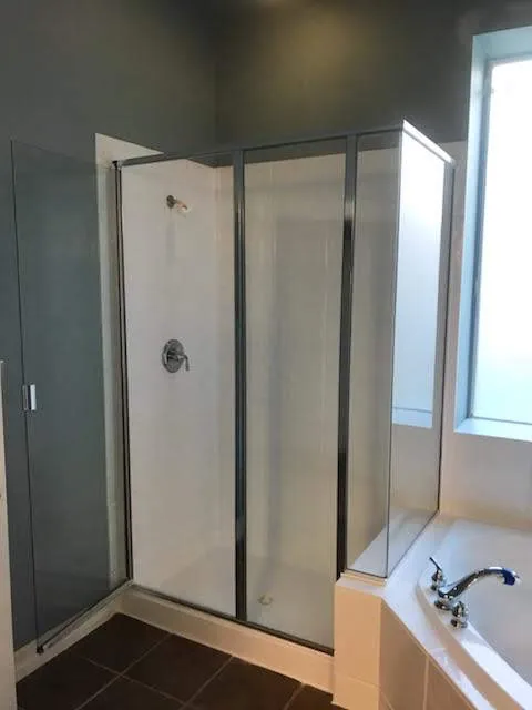 Same shower stall refinished in white, after