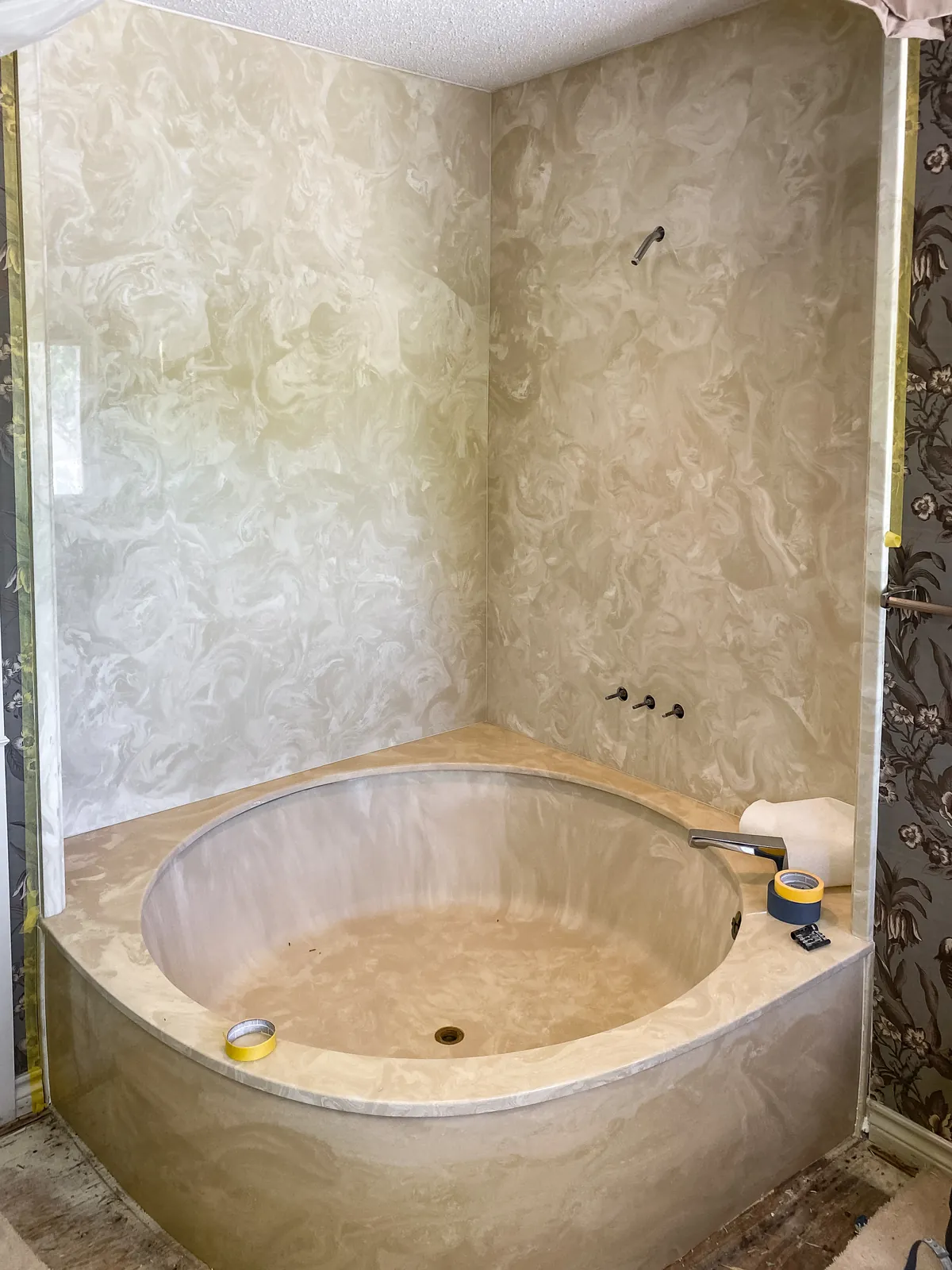 Yellowed cultured marble garden tub and surround before refinishing