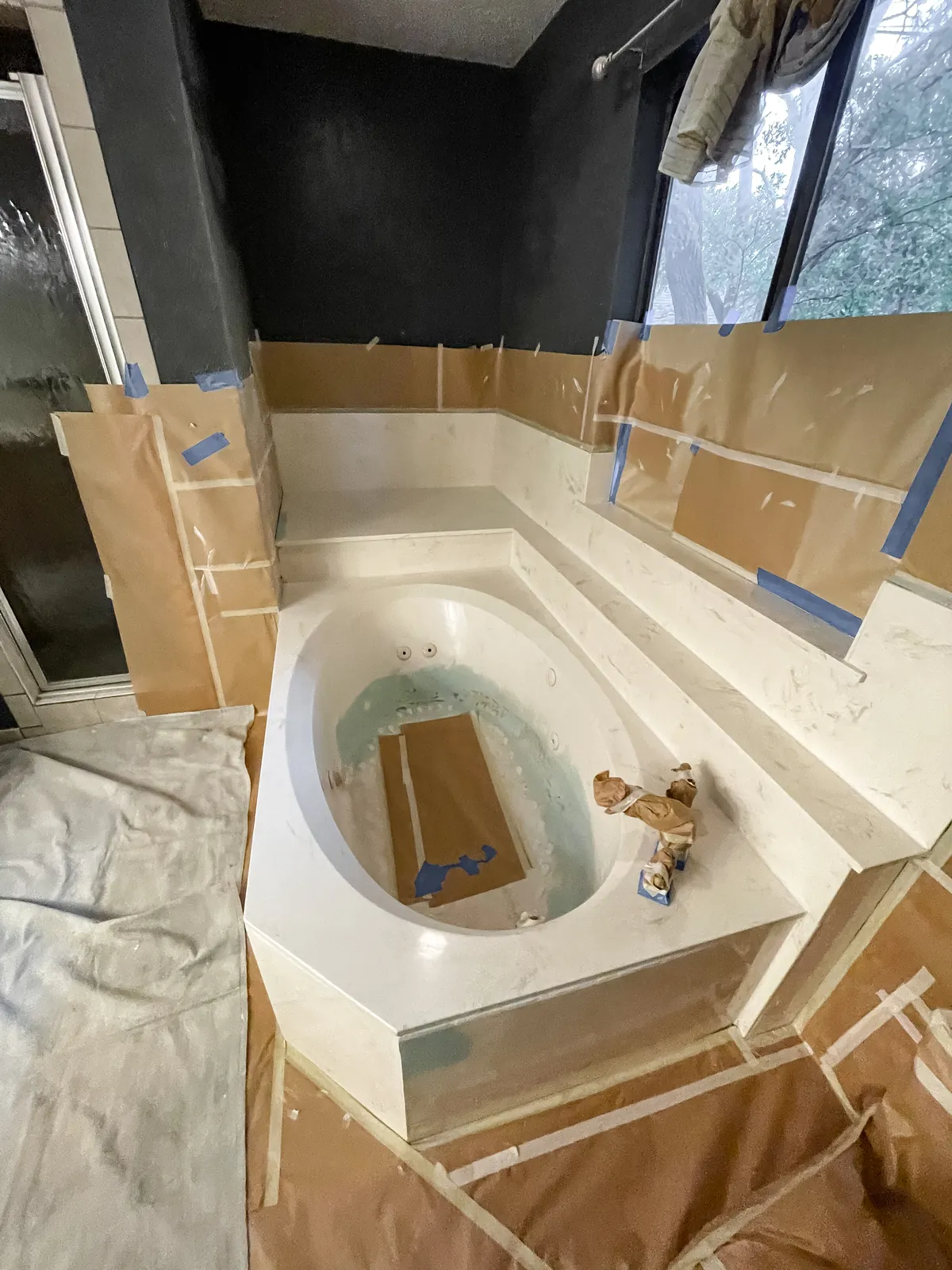 Filler worked into the cracks around the tub floor