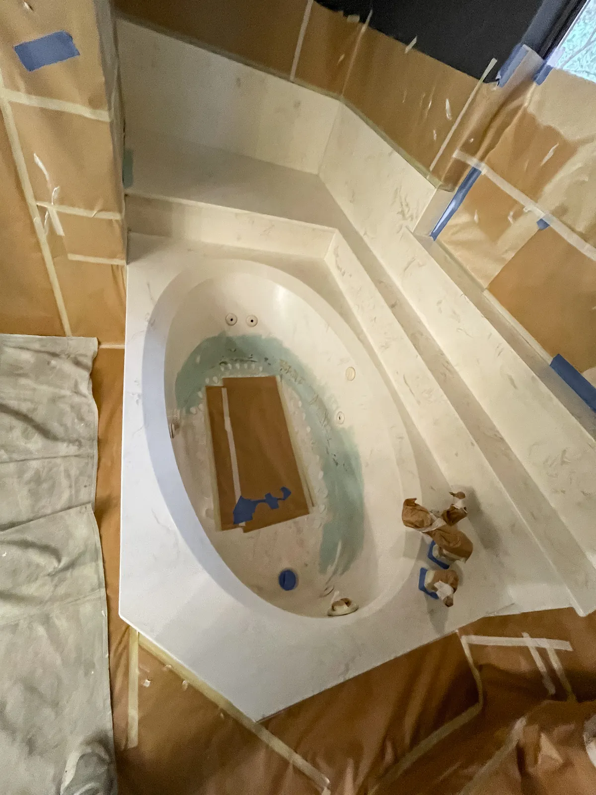 Repairs sanded flush to the tub, jets masked