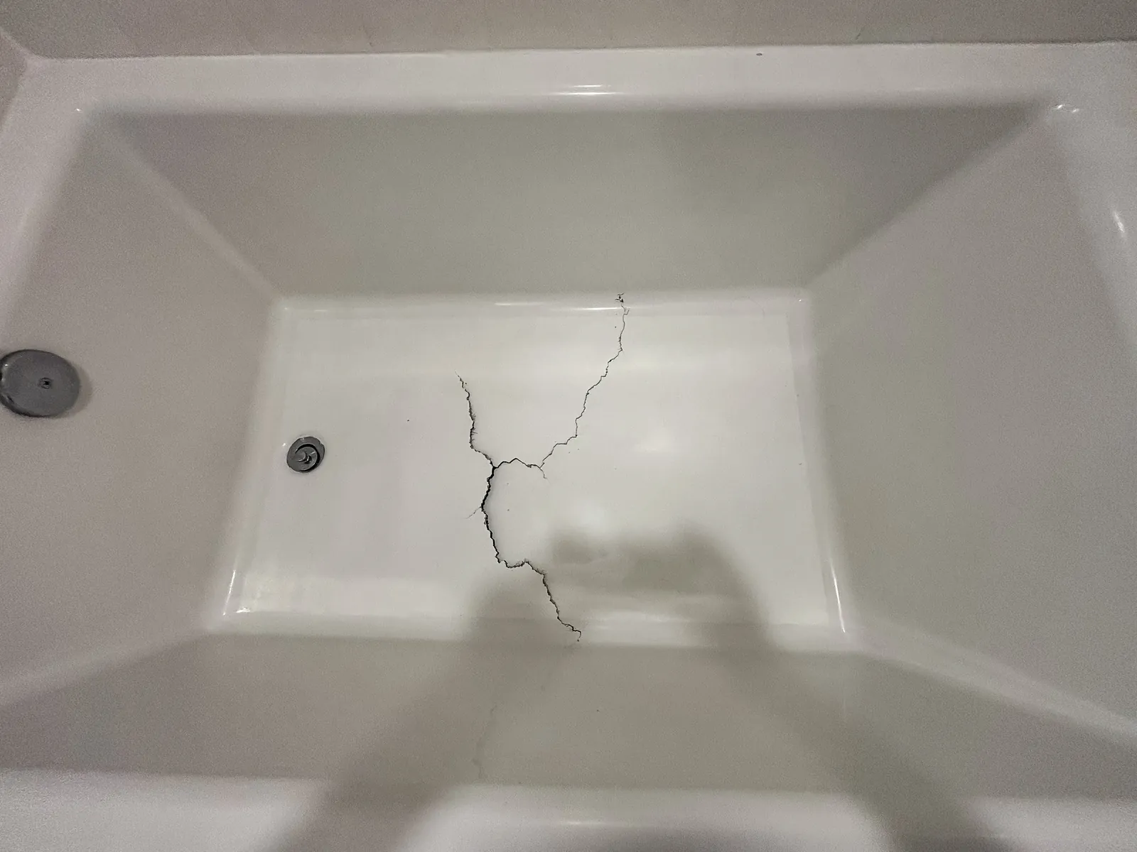 Crack across a fiberglass tub floor