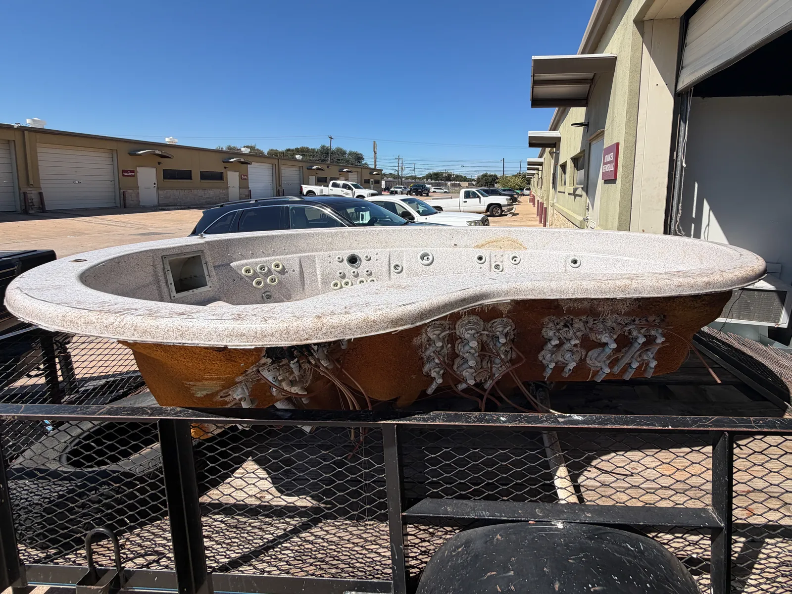 Hot tub shell arriving at the shop on a trailer