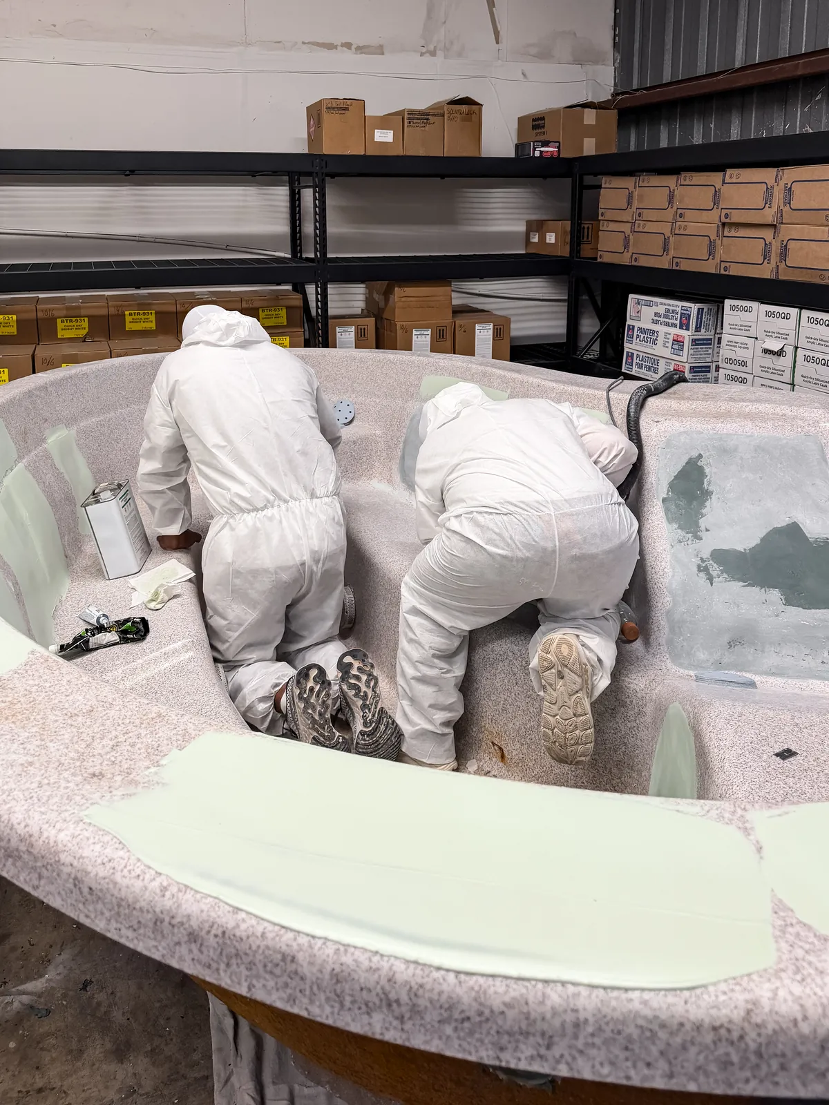 Fiberglass repairs on the hot tub shell before refinishing