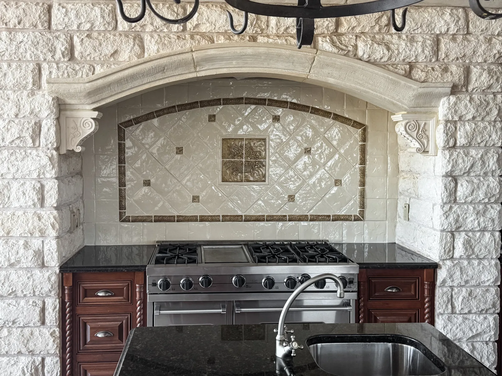 Kitchen tile backsplash refinished in a lighter stone tone