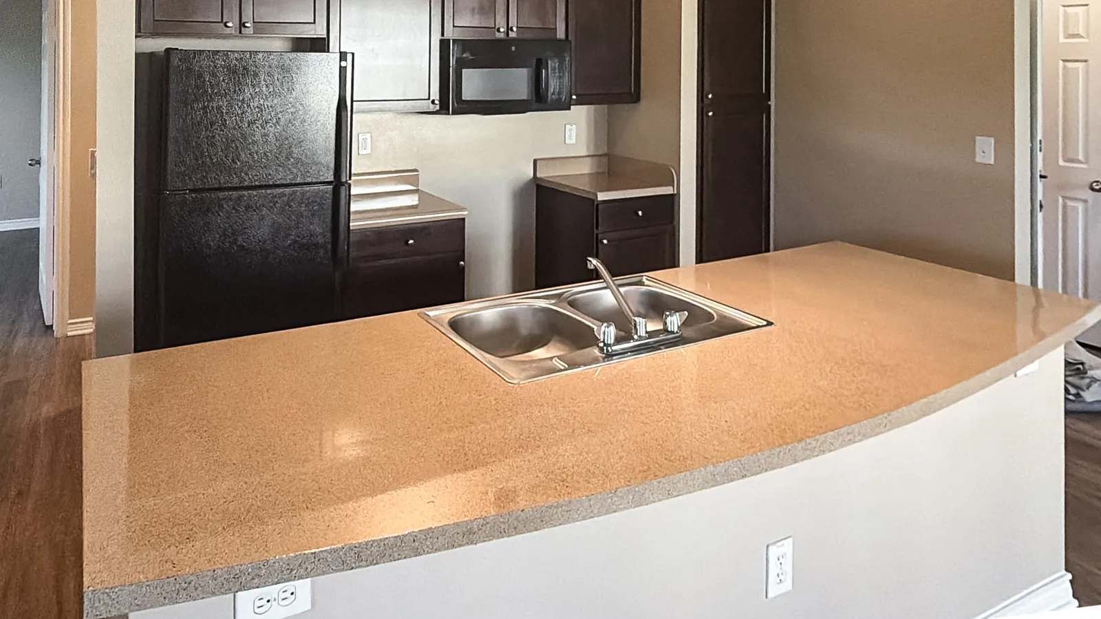 Same island refinished in a tan granite-look fleck, after